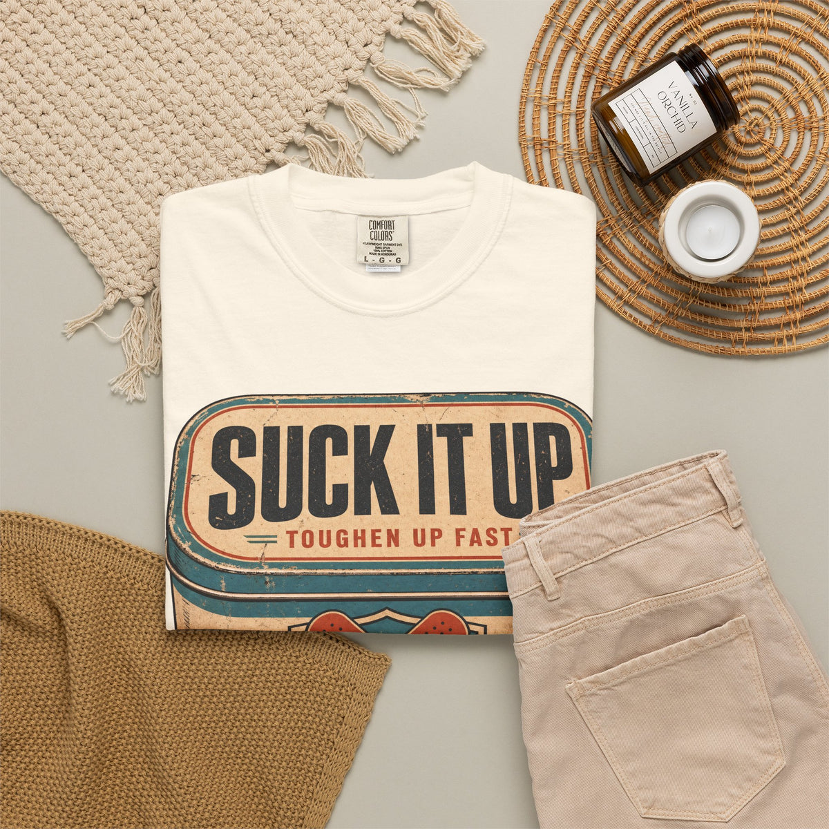 Suck It Up Bandage Tin T-shirt in Ivory, flat lay view
