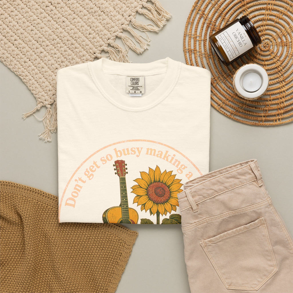 Don't Get So Busy Making A Living Dolly T-shirt in Ivory, flat lay view