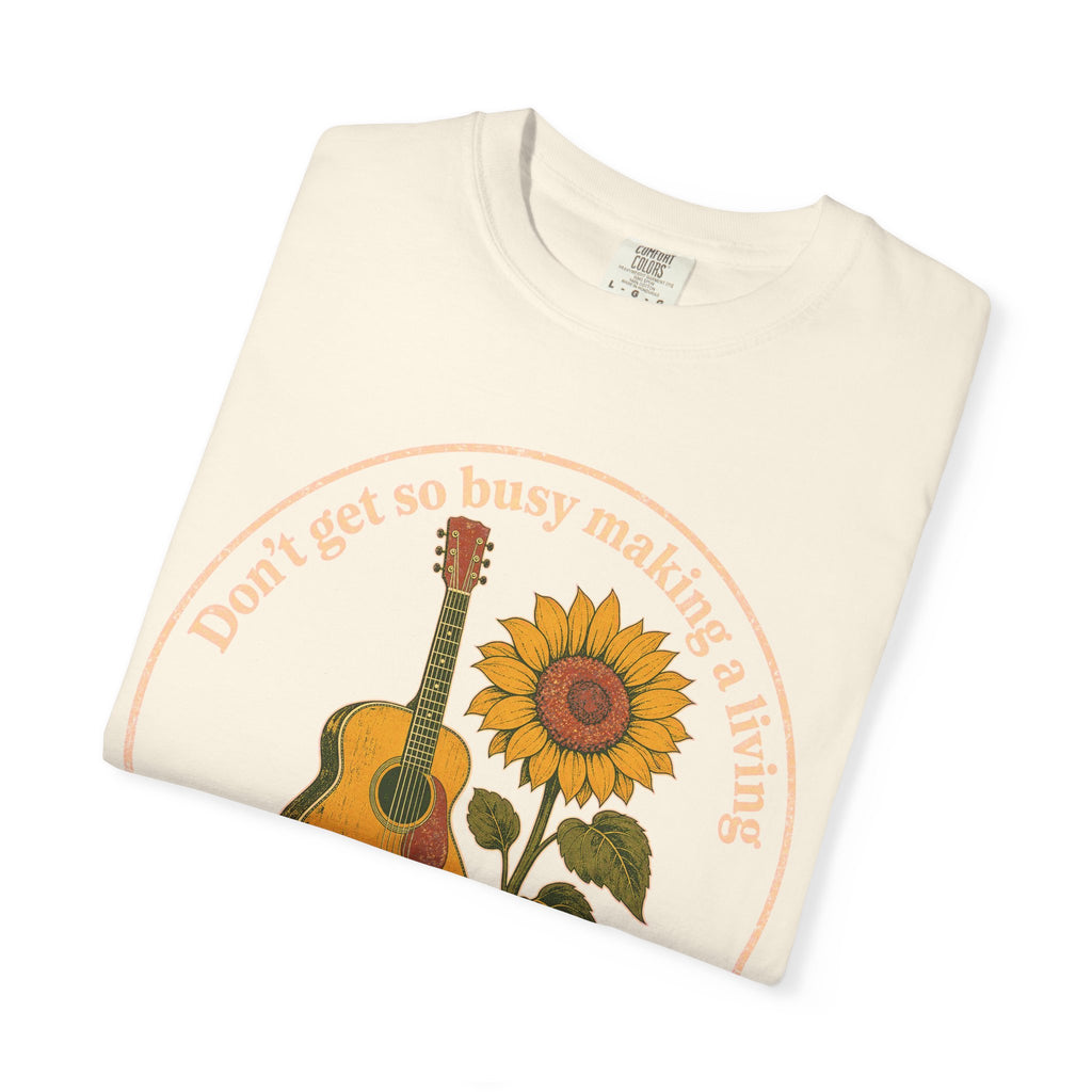 Don't Get So Busy Making A Living Dolly T-shirt in Ivory, folded view