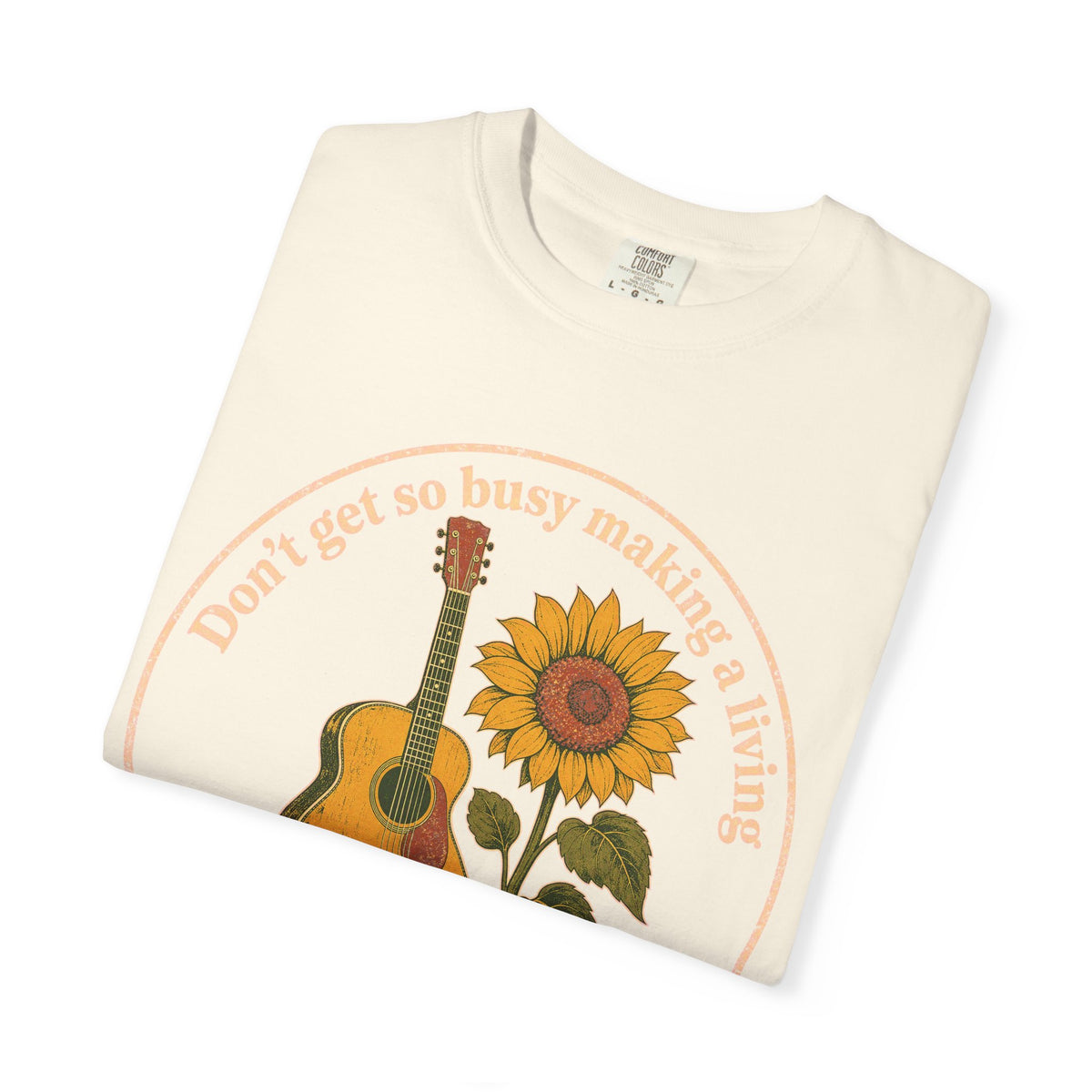 Don't Get So Busy Making A Living Dolly T-shirt in Ivory, folded view